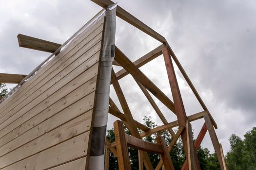 construction of a frame house. Timber frame house, new build roof