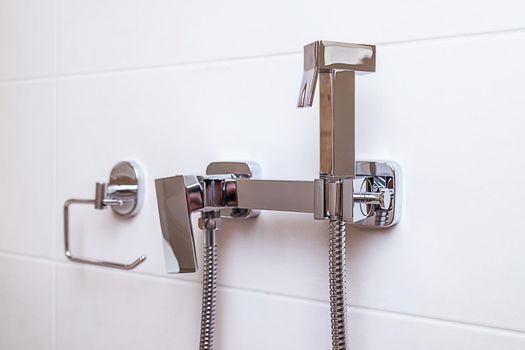 home chrome hygienic bathroom shower, modern apartment style, close-up