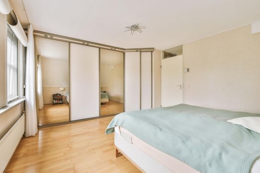 Mansard bedroom with minimalist interior design