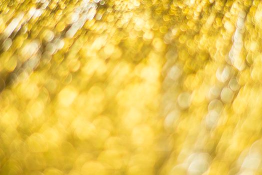 Gold bokeh. Abstract background. Defocused lights.