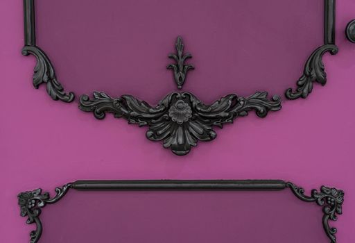 Vintage royal silver horizontal background with black ornaments on a pink wall