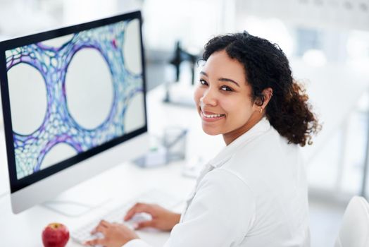 This discovery could lead to a cure. a female scientist using her computer while sitting in a lab.