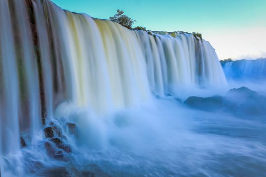 Iguacu falls in southern Brazil at dawn, long exposure and blurred waters