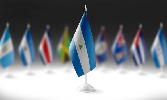 The national flag of the Nicaragua on the background of flags of other countries