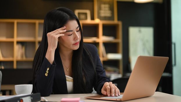 Frustration female entrepreneur holding her head, thinking find solution problem of work. Emotional pressure, stress at work concept