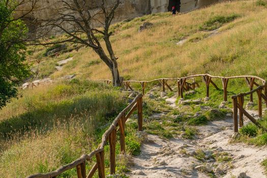 Ancient road chufut cave bakhchisaray city crimea medieval fortress stone, concept history sky in historic and settlement cloudy, limestone landmark. Town outdoors stony,