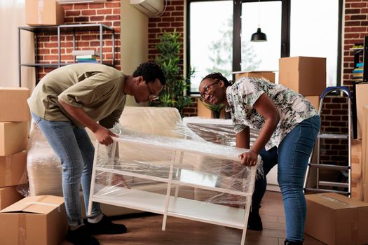 African american couple moving in new apartment together