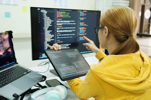 Programmer is coding and programming software.