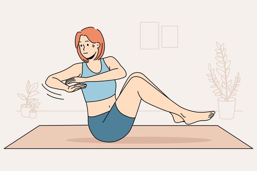 Woman training on mat at home