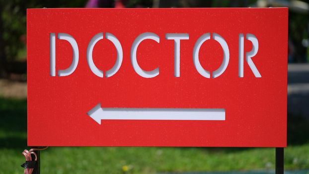 Text doctor on red pointer with arrow