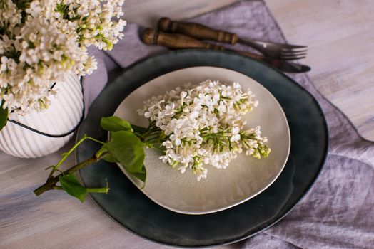 Spring table setting with white lilac