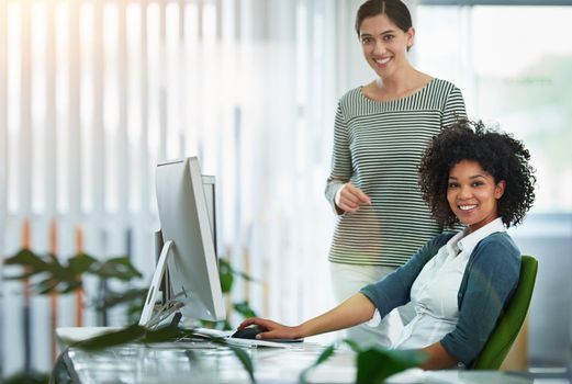 Trainee, intern or new employee with her manager, supervisor or human resources manager in the office. Portrait of happy, smiling and ambitious business women and colleagues at a desk at work