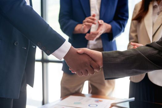 businessman handshake for teamwork of business merger and acquisition