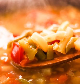 Cooking vegetable soup in saucepan, comfort food and homemade meal