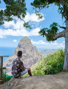 Men hiking in Saint Lucia Caribbean, nature trail in the jungle of Saint Lucia huge Pitons