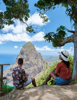 Couple hiking in Saint Lucia Caribbean, nature trail in the jungle of Saint Lucia huge Pitons