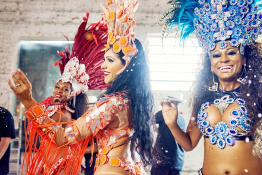 Samba is the spice of life. beautiful samba dancers performing at a carnival.