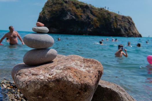 Meditation beach pyramid balance zen sea stones summer coast gray, concept nature spa from landscape and rock background, spiritual travel. Gravel spirituality therapy,