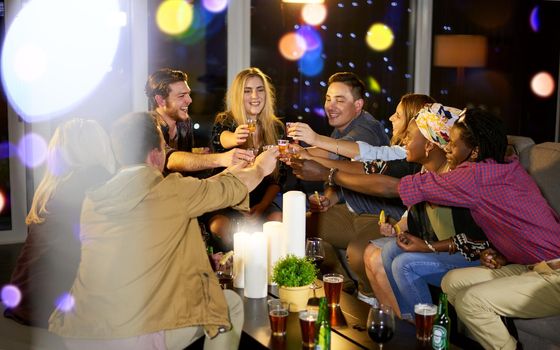 Cheers to the weekend and enjoying ourselves. a group of friends having fun at a nightclub.