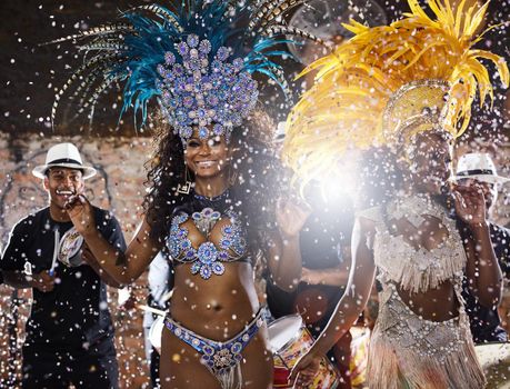 Its going to be one entertaining night. samba dancers performing in a carnival.
