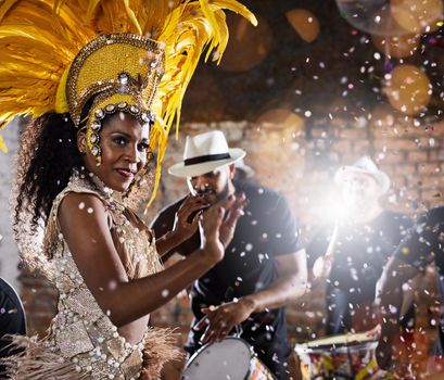 Her moves will leave you captivated. samba dancers performing in a carnival.