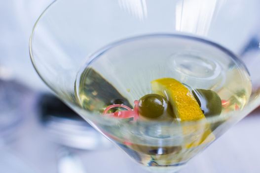 Glass of martini with olives