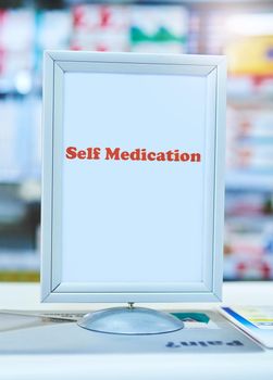 The self medication counter makes it easier for customers. a sign with the words self medication written on it at a pharmacy.