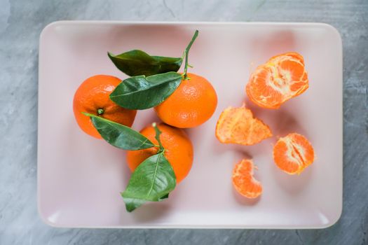 juicy ripe tangerines - fresh fruits and healthy eating styled concept