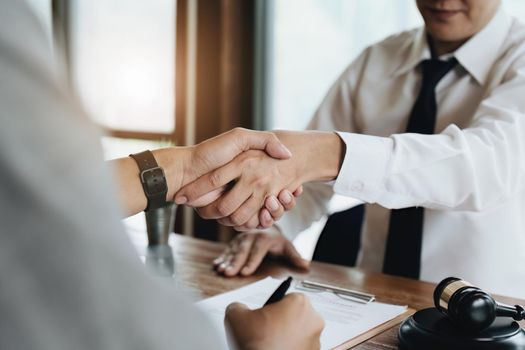 Real Estate Agents are shaking hands with customers to congratulate