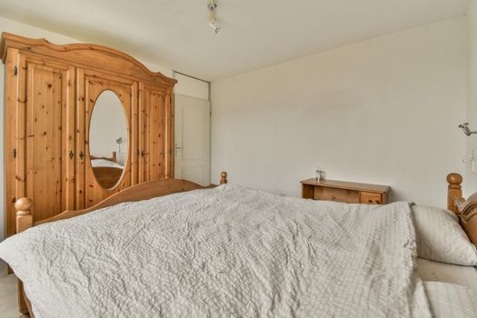 Bed and wardrobe in small bedroom