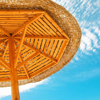 beach umbrella - travel, vacation and summer holidays concept
