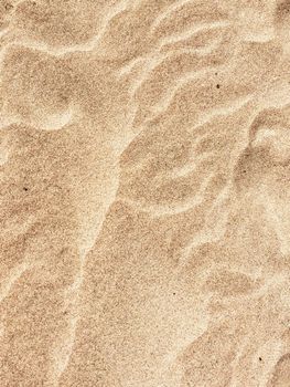 beach sand in summertime - travel, seascape, vacation and summer holidays concept