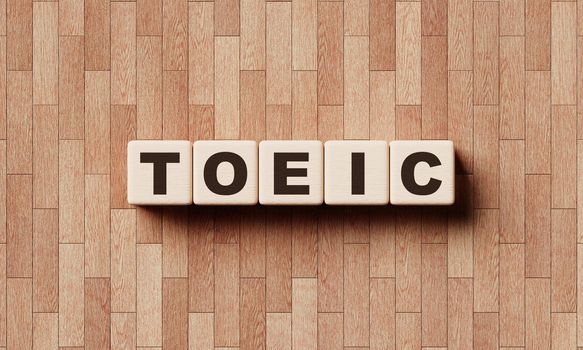 TOEIC words from wooden blocks with letters. Education courses and test of English as a foreign language concept. 3D illustration rendering