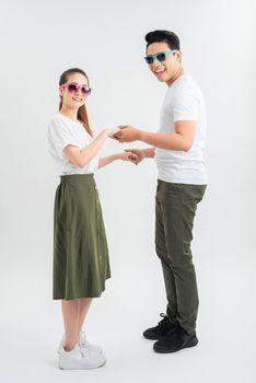 Full length shot of asian couple isolated on white. Man in casual attire chilling with girlfriend