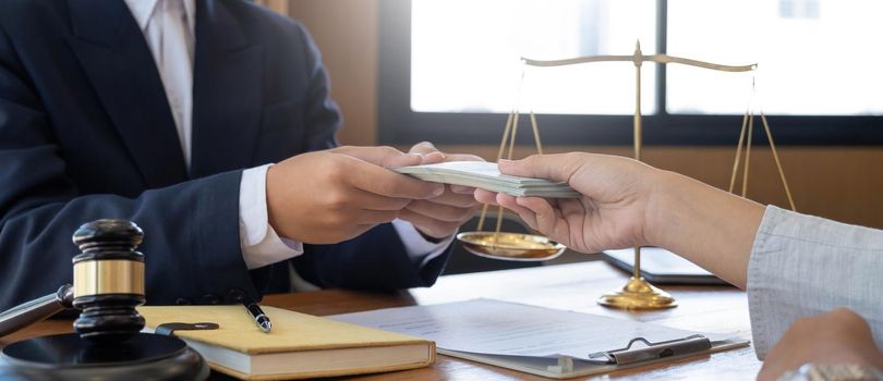 lawyer or judge is taking a bribe. In the client's courtroom at the lawyer's office In order to bribe to gain an advantage in the form of lawsuits, the concept of bribery and corruption in law