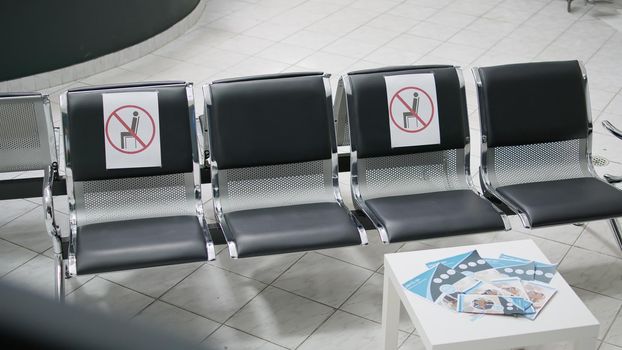 Nobody sitting on empty chairs at facility waiting room area
