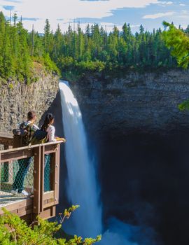 Helmcken Falls Wells Gray park British Colombia Canada, couple men and women watching waterfall