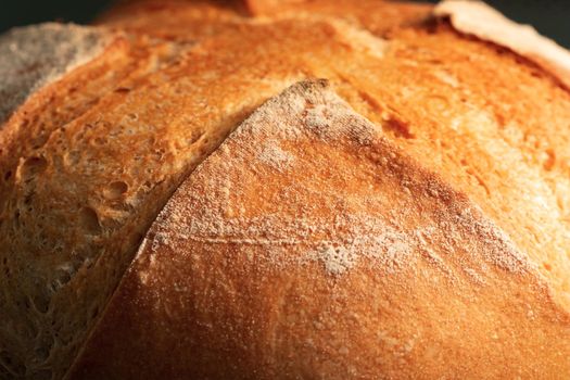 Fresh homemade round wheat crispy bread close-up, selective focus