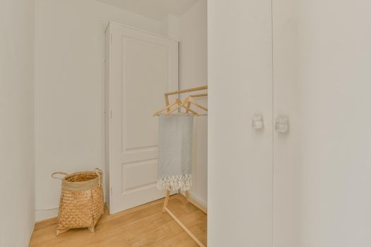 Narrow corridor with closet and cabinet