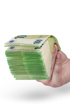 Stack of money in hand isolated on white background. 100 euro banknotes in a man's hand. A man holds out his hand with a stack of banknotes as a concept for a loan, insurance or mortgage.