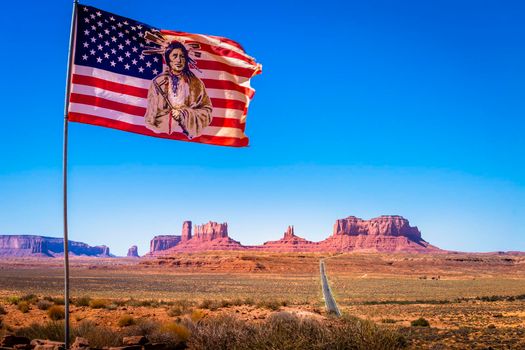 Highway Road Highway 163 and Monument Valley with american flag, USA