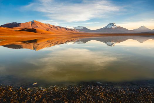 Idyllic Lake Lejia reflection and volcanic landscape in Atacama desert, Chile