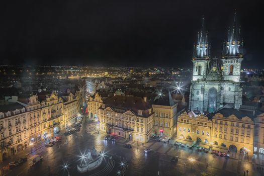 Above Prague old town square and Tyn cathedral at night, Czech Republic