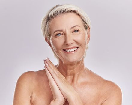 Soft skin, antiaging or wrinkle free senior woman looking happy with her skincare, hygiene and beauty nighttime or bedtime routine. Beautiful, wellness model portrait in studio with perfect skin care