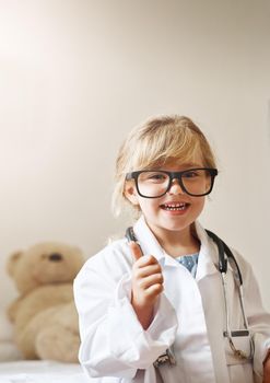 Does your medical aid cover your offspring. Portrait of an adorable little girl dressed up as a doctor.