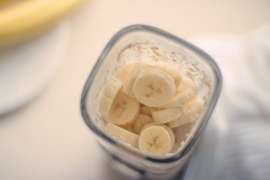 banana cocoa smoothie - healthy eating recipe styled concept
