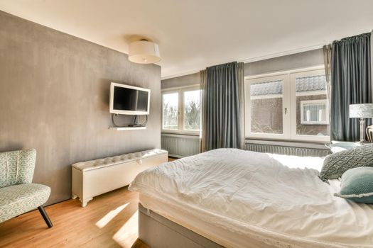 Modern bedroom with wide window