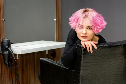 Woman with short pink hairstyle
