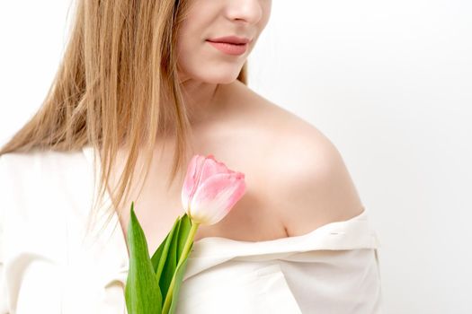 Woman with one pink tulip