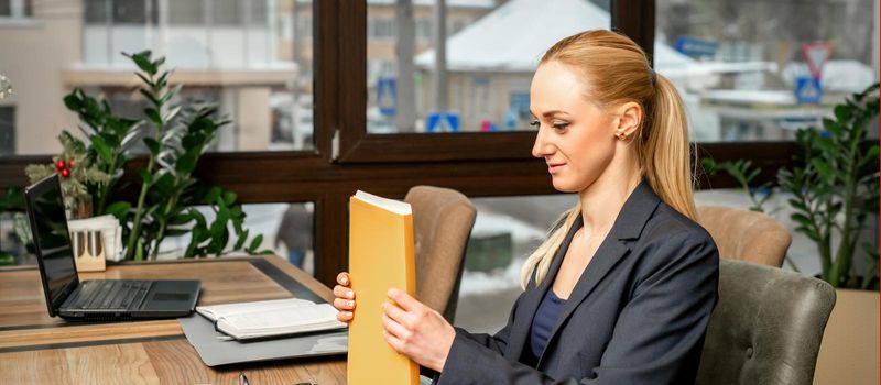 Businesswoman with folder with documents